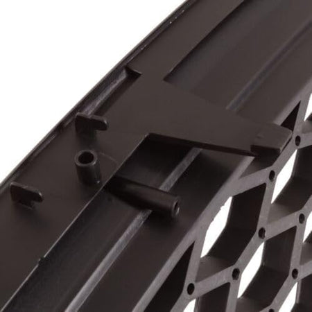 Rear detail of German Auto Stuff matte black honeycomb badgeless grille showing the mounting clips