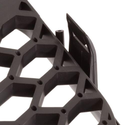 Rear view of German Auto Stuff matte black honeycomb badgeless grille showing the frame and mounting points