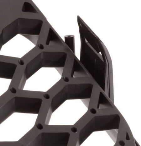 Rear view of German Auto Stuff matte black honeycomb badgeless grille showing the frame and mounting points